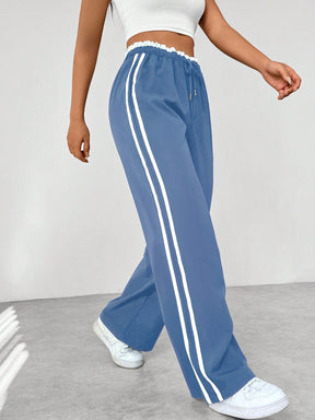 Sanne | Dames sportieve wide-leg broek met zijstrepen en trekkoord